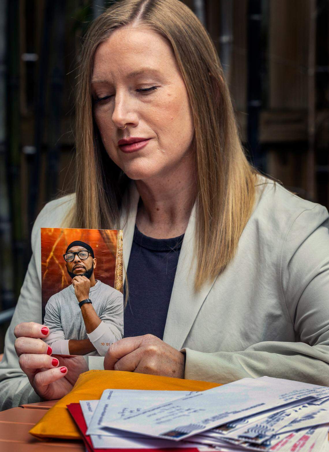 Heather Mitchell shows a photograph of her husband Marcus Mitchell who has been on death row in Raleigh’s Central Prison for 27 years. He has long been an advocate for death row inmates receiving educational programing.