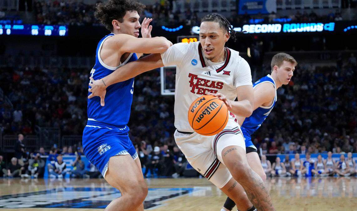 Texas Tech Red Raiders forward Darrion Williams (5) dribbles the ball against Drake Bulldogs forward Daniel Abreu (54) during their game at Intrust Bank Arena.