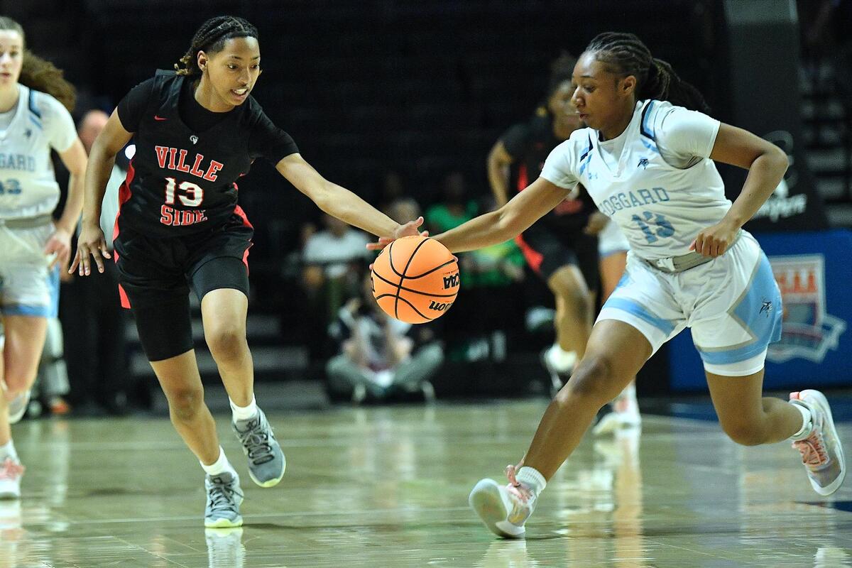 Hoggard’s Jakicey Gardner (13) forces the turnover against Rolesville’s Justice Everett in the NCHSAA 4A East Regional Finals. Rolesville and Hoggard met in the NCHSAA 4A East Regional Championship game in Winston-Salem, N.C. on March 14, 2024.