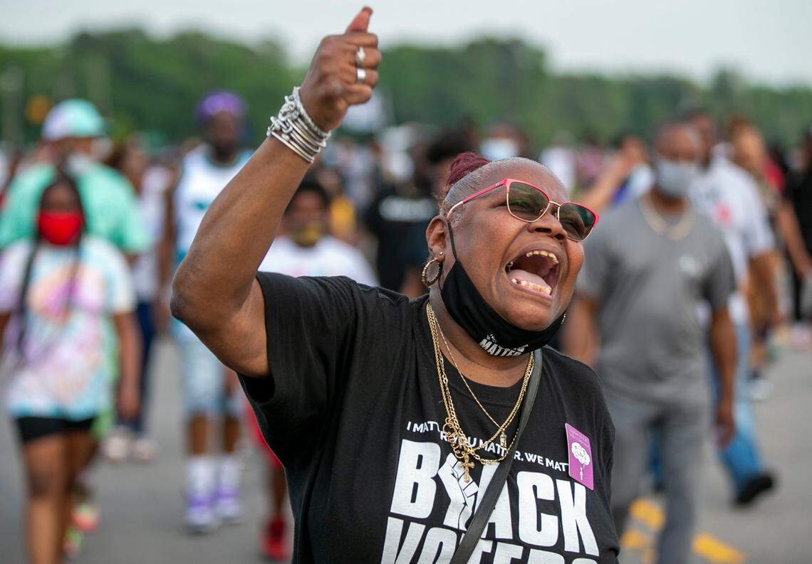 Celeste Taylor chants as she leads demonstrators on Halstead Ave. in Elizabeth City, N.C. on Thursday, April 29, 2021. This is the ninth day of demonstrations in the wake of Andrew Brown Jr.s death at the hands of Pasquotank County deputies.