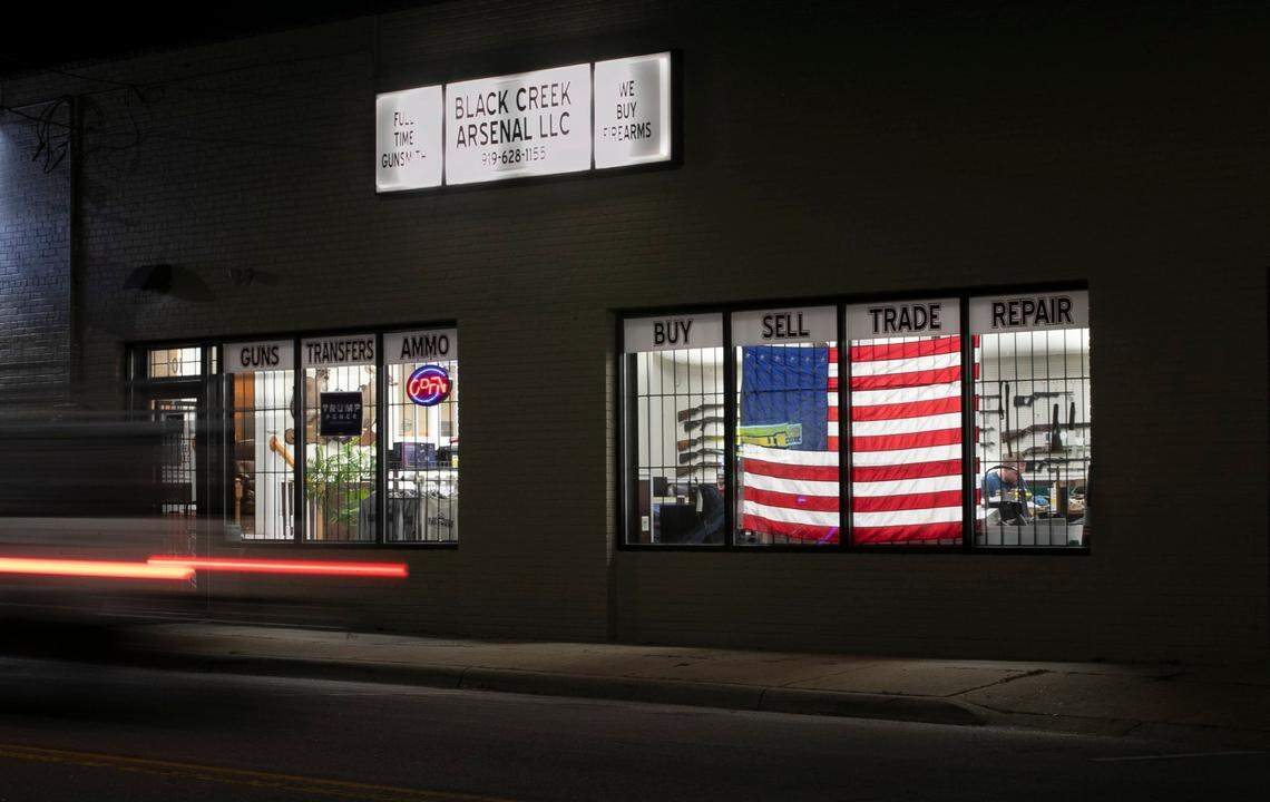 Night falls on downtown Four Oaks, N.C. as traffic moves past Black Creek Arsenal on Wellons Street on Thursday, November 5, 2020.