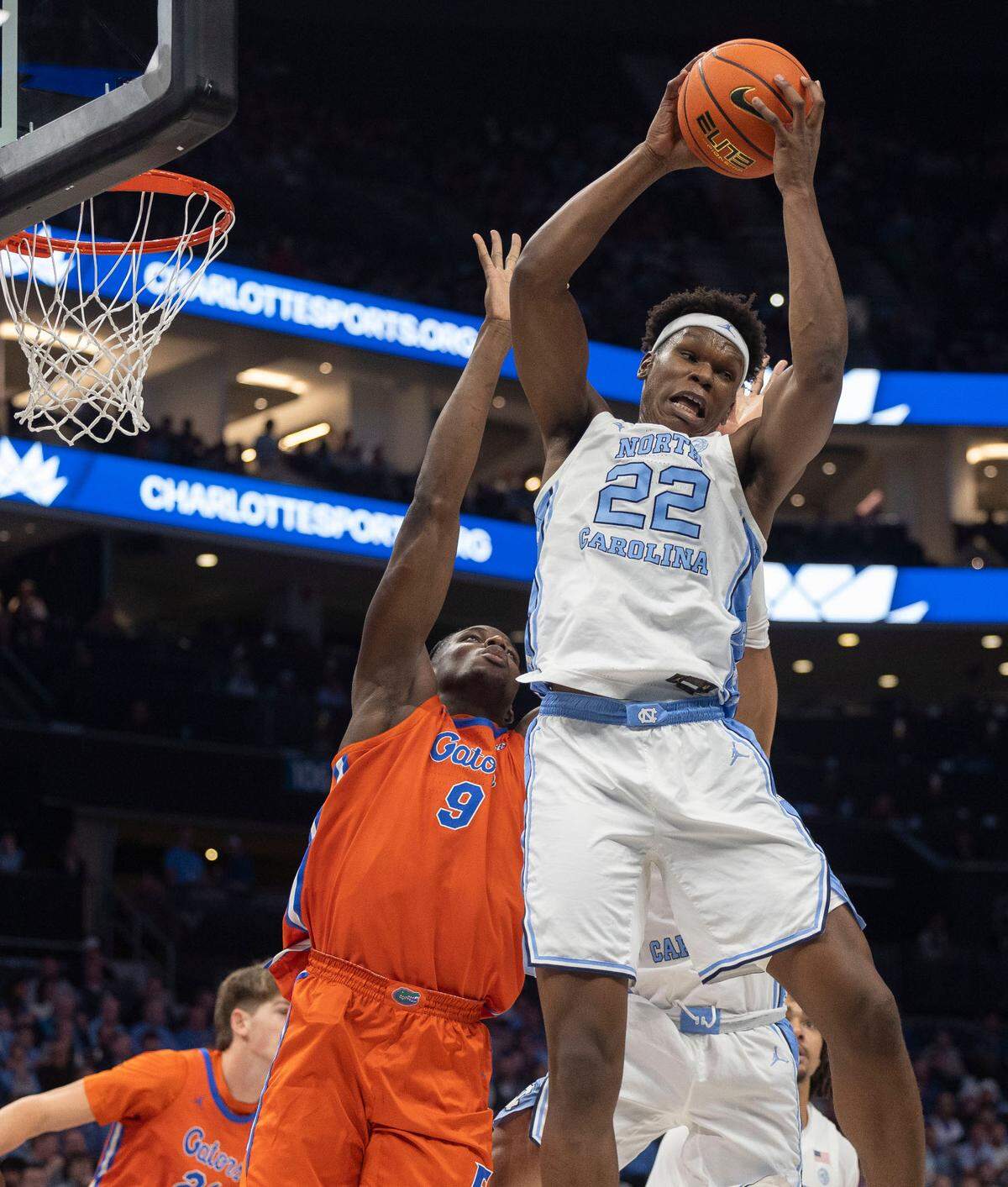 North Carolina forward Ven-Allen Lubin (22) secures a defensive rebound over Florida’s Reuben Chinyelu (9) in the first half during the Jumpman Invitational on Tuesday, December 17, 2024 at the Spectrum Center in Charlotte, N.C.