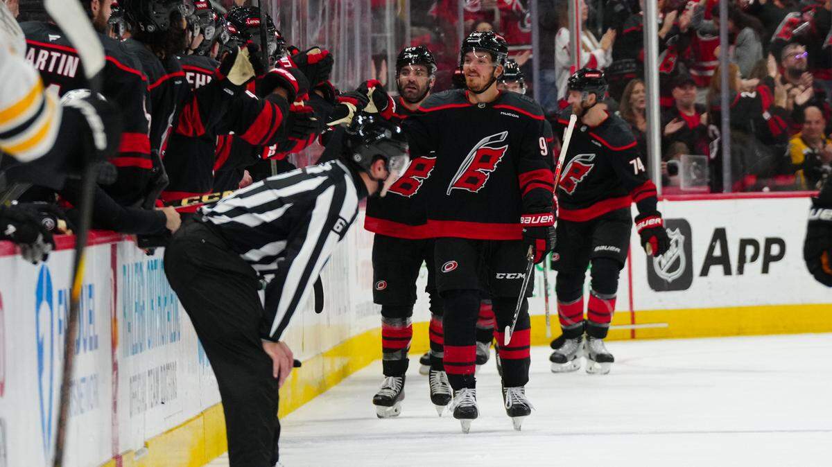 Oct 31, 2024; Raleigh, North Carolina, USA; Carolina Hurricanes center Jack Roslovic (96) celebrates his goal against the Boston Bruins during the second period at Lenovo Center. Mandatory Credit: James Guillory-Imagn Images