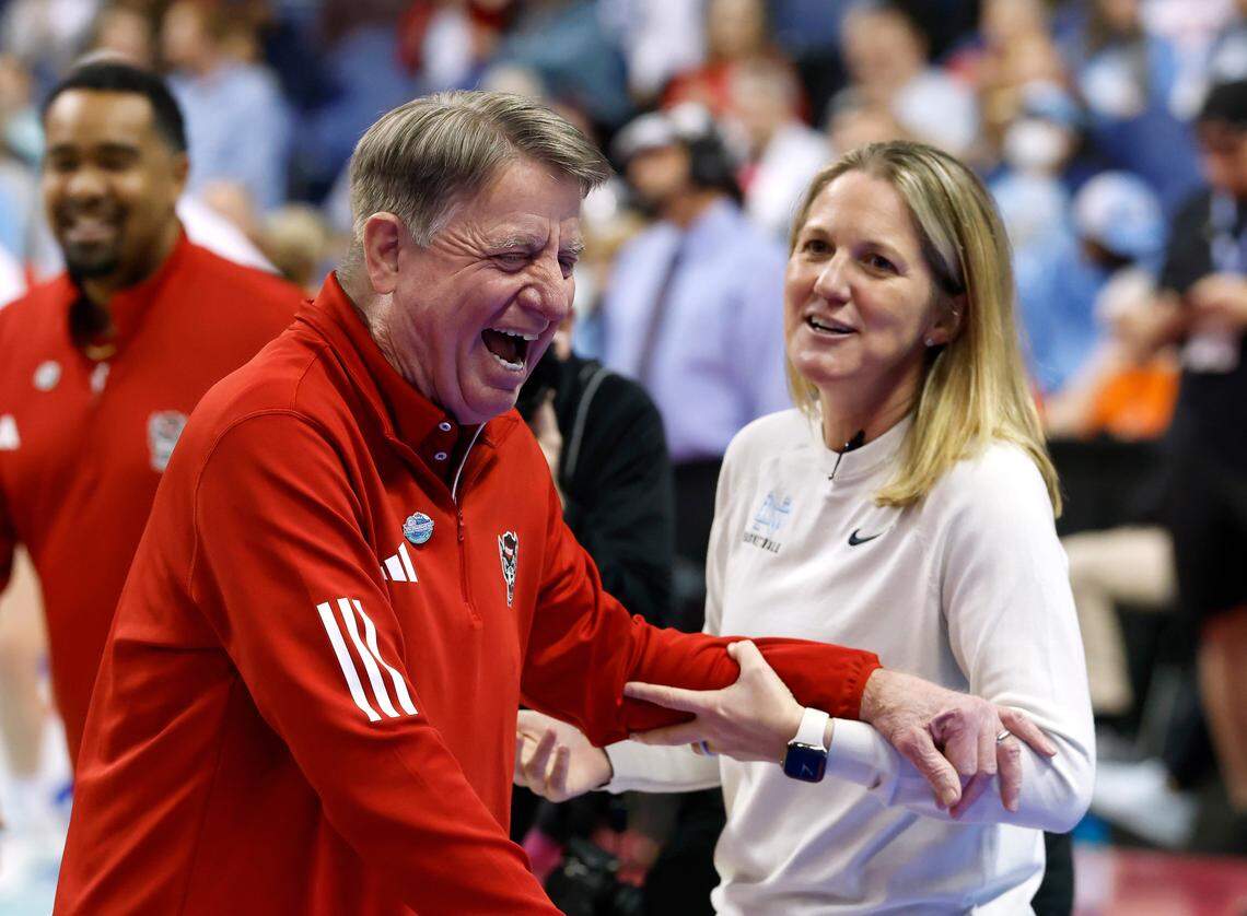 N.C. State head coach Wes Moore and North Carolina Head coach Courtney Banghart share a laugh prior to their teams’ match-up in the ACC Tournament semifinals on Saturday, March 8, 2025, at First Horizon Coliseum in Greensboro, N.C.