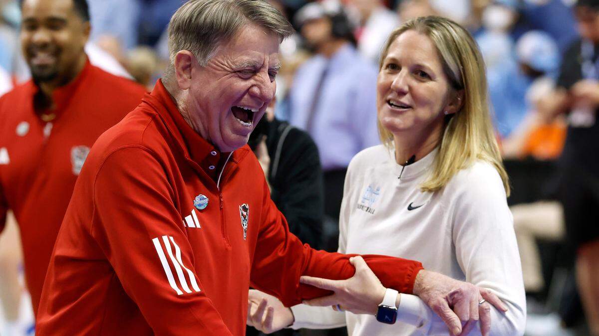 N.C. State head coach Wes Moore and North Carolina Head coach Courtney Banghart share a laugh prior to their teams’ match-up in the ACC Tournament semifinals on Saturday, March 8, 2025, at First Horizon Coliseum in Greensboro, N.C.