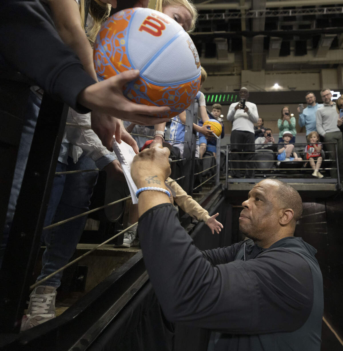 North Carolina coach Hubert Davis signs autographs for fans following the Tar Heels’ practice on Wednesday, March 18, 2026, at Bon Secours Arena in Greenville, S.C.