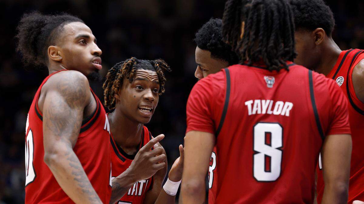 N.C. State’s Trey Parker (5) huddles with his teammates during the second half of the Wolfpack’s 74-64 loss to Duke on Monday, Jan. 27, 2025, at Cameron Indoor Stadium in Durham, N.C.