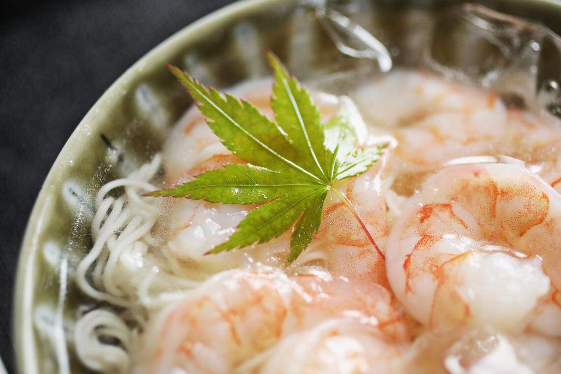 Cold somen noodles are served plain in a bowl of ice water and the noodles are meant to be dipped in the accompanying bowl of dashi dipping sauce. Small dishes of wasabi, ginger and grated daikon are also provided to tweak the flavor at Zanyu in Raleigh.