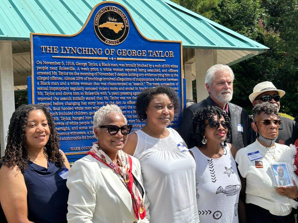 Members of George Taylor’s family stand with Rolesville Mayor Ronnie Currin near the spot where Taylor was lynched in 1918, now commemorated with a marker.