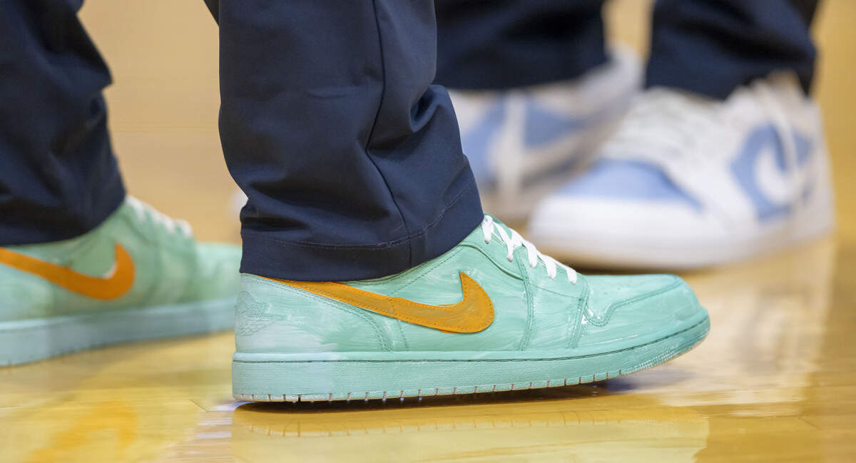 North Carolina assistant coach Pat Sullivan wears a pair of custom painted shoes for the Coaches vs Cancer fundraiser for pediatric cancer on Monday, Feb 2, 2026 at the Smith Center in Chapel Hill, N.C. The shoes were painted by patients from UNC Children’s Hospital.
