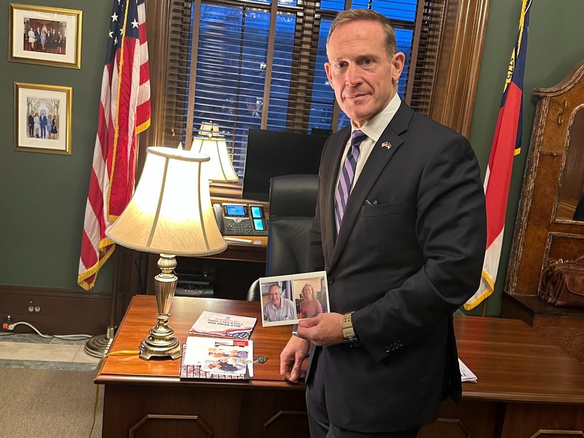 Sen. Ted Budd holds a photo of the Keith and Aviva Siegel, a couple, with ties to North Carolina, taken by Hamas during the Oct. 7 attack on Israel.
