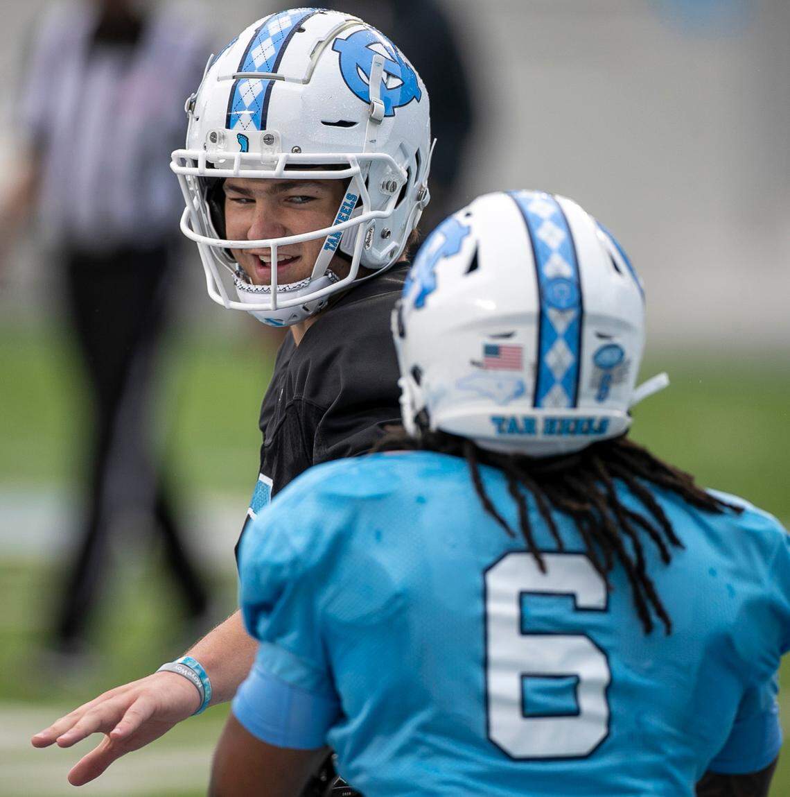North Carolina quarterback Drake Maye (10) congratulates wide receiver Nate McCollum (6) after a pass reception for a touchdown during the Tar Heels’ open practice on Saturday, March 25, 2023 at Kenan Stadium in Chapel Hill. N.C.