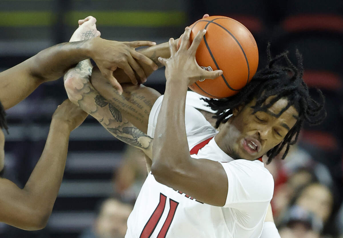 N.C. State’s Dennis Parker Jr. (11) pulls in the rebound during the second half of N.C. State’s 81-67 victory over UT Martin at PNC Arena in Raleigh, N.C., Tuesday, Dec. 12, 2023.