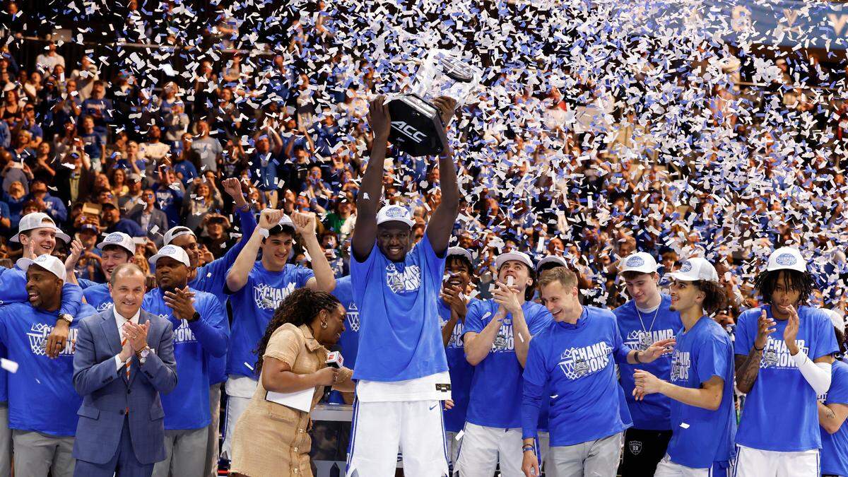 Duke celebrates after defeating Louisville to win the ACC Mens Basketball Tournament championship game. 