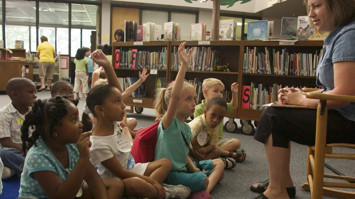 Katrina Ingram’s kindergarten class visits Summer Pittman for story time in the Media Center at Knightdale Elementary School. in this 2007 file photo.