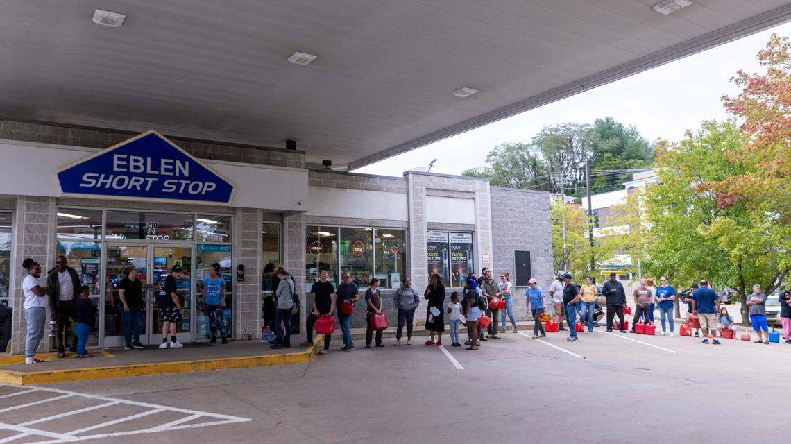 Asheville residents residents line up for gasoline at a gas station on Sunday, Sept. 29, 2024. The remnants of Hurricane Helene caused widespread flooding, downed trees, and power outages in western North Carolina.