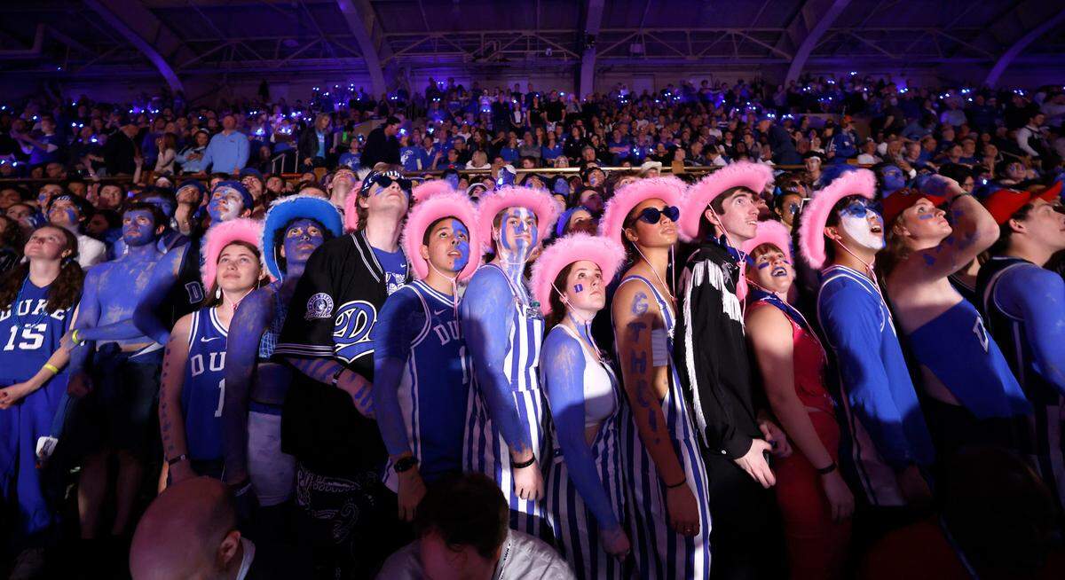 The Cameron Crazies watch the pregame video before Duke’s game against UNC at Cameron Indoor Stadium in Durham, N.C., Saturday, March 9, 2024.