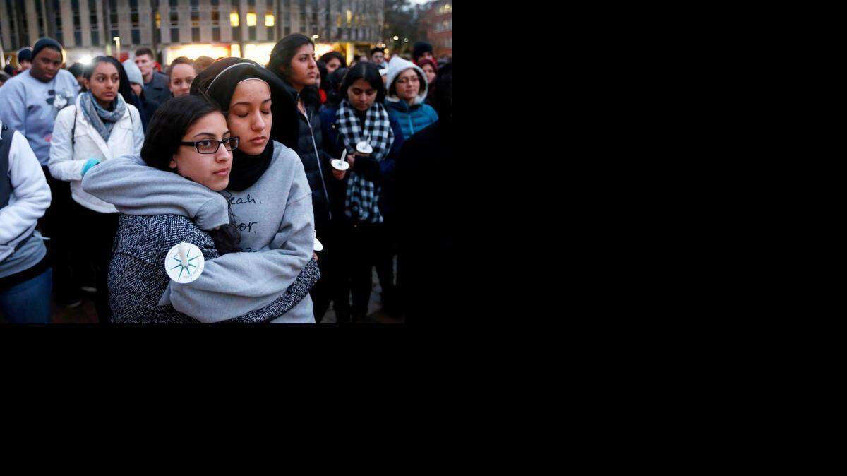 N.C. State sophomore Firdaws Chahrour, right, hugs Danyah Dahbour before a vigil Thursday at N.C. State for Deah Barakat, 23; his wife, Yusor Abu-Salha, 21; and Abu-Salha’s sister, Razan Abu-Salha, 19. The three were killed Tuesday evening in Chapel Hill.
