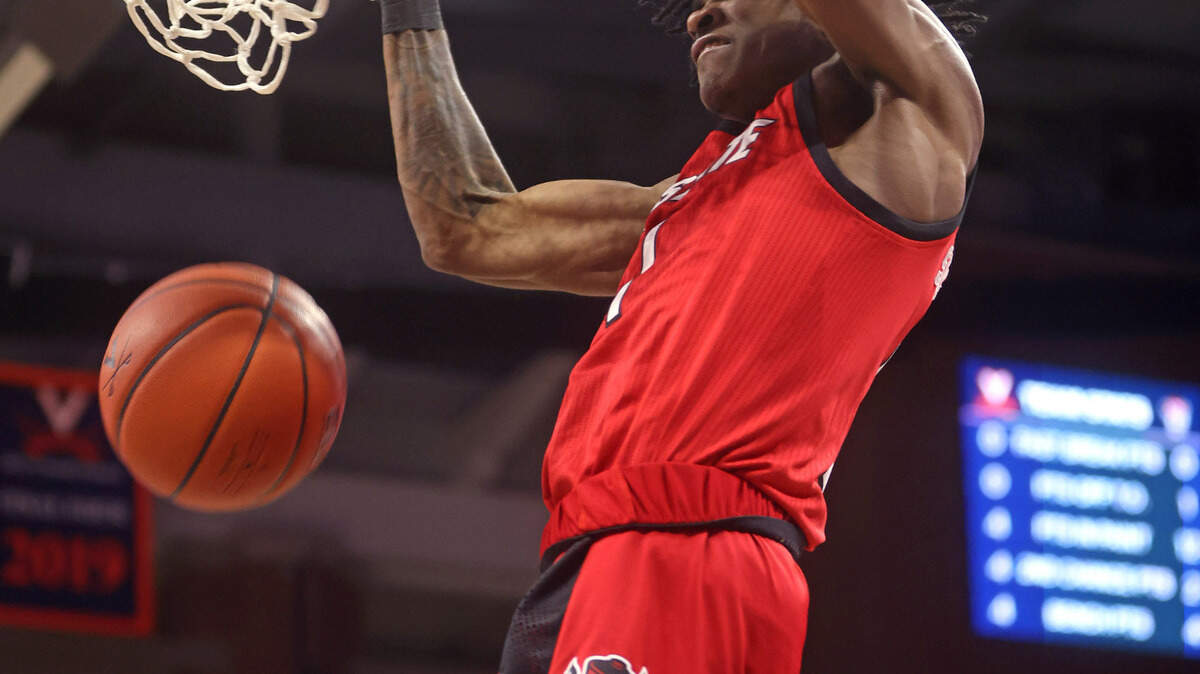 N.C. State’s Dereon Seabron (1) slams in two during the Wolfpack’s victory over Virginia in Charlottesville, Va., Wednesday, February 24, 2021.
