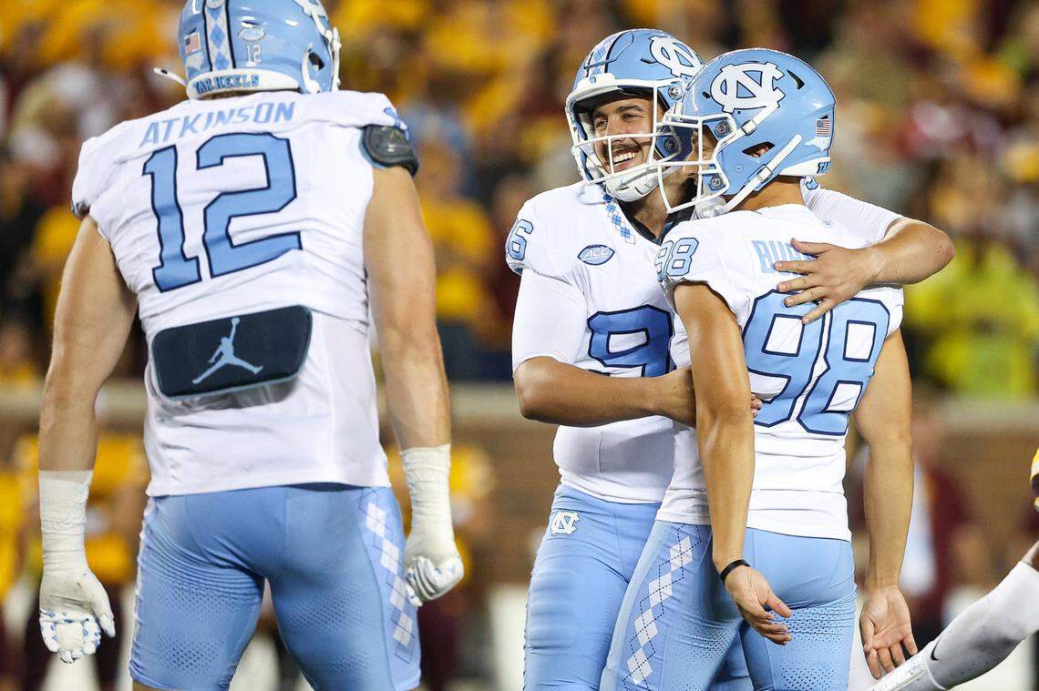 Aug 29, 2024; Minneapolis, Minnesota, USA; North Carolina Tar Heels place kicker Noah Burnette (98) and punter Tom Maginness (96) celebrate during the second half against the Minnesota Golden Gophers at Huntington Bank Stadium. Mandatory Credit: Matt Krohn-USA TODAY Sports