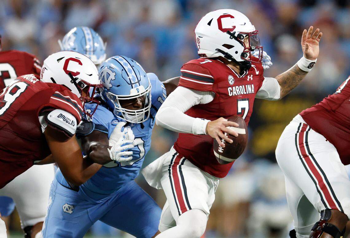 North Carolina defensive lineman Desmond Evans (10) heads in to sack South Carolina quarterback Spencer Rattler (7) during the second half of UNC’s 31-17 victory over South Carolina in the Duke’s Mayo Classic at Bank of America Stadium in Charlotte, N.C., Saturday, Sept. 2, 2023.