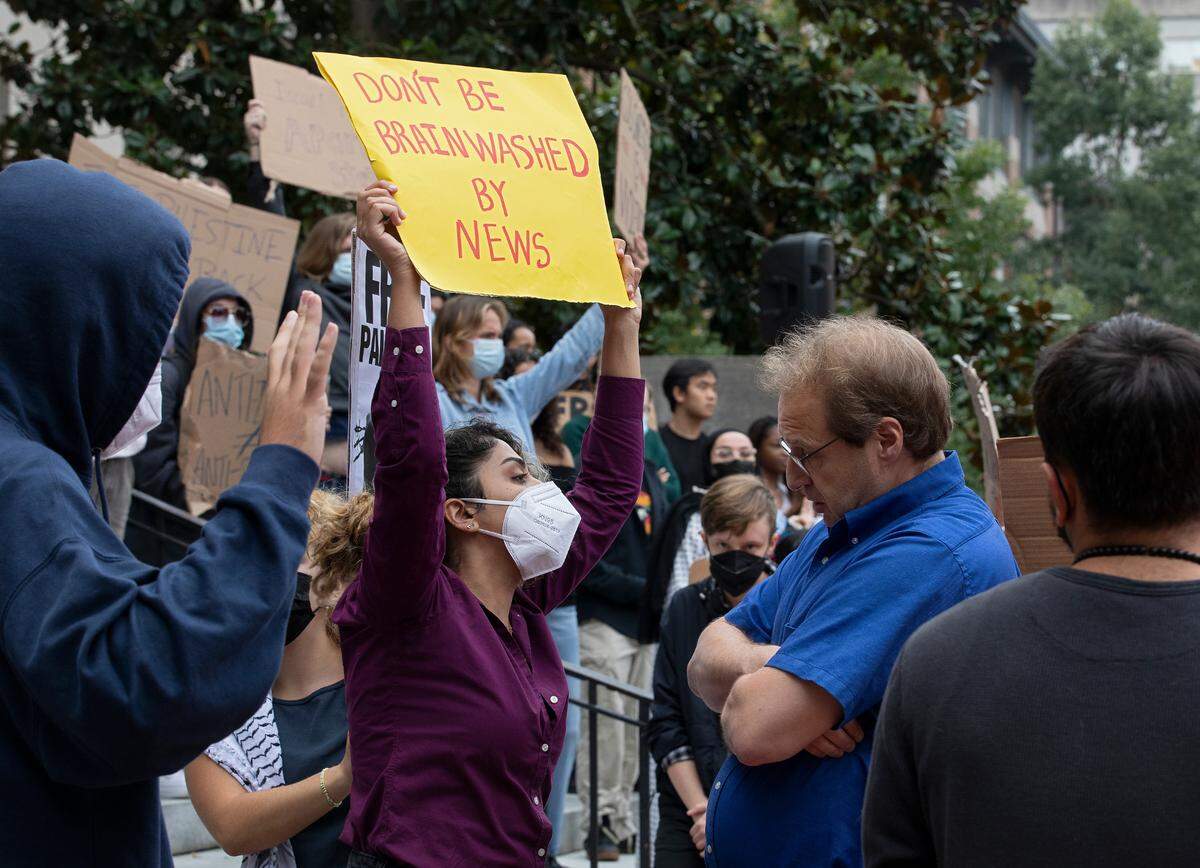 Pro-Palestinian demonstrators and counter-protesters interact during a rally in support of Palestinians at UNC-Chapel Hill on Thursday, Oct. 12, 2023. The rally was organized by the UNC chapter of Students for Justice in Palestine.