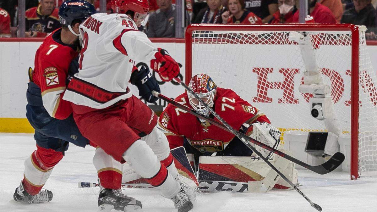 The Florida Panthers Radko Gudas (7) defends the Carolina Hurricanes Jordan Martinook (48) as he tries to shoot on Panthers goalie Sergei Bobrovsky (72) in the first period of Game 4 of the Eastern Conference Finals on Wednesday, May 24, 2023 at FLA Live Arena in Sunrise, Fla.