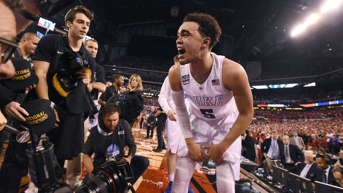 Duke’s Tyus Jones (5) celebrates after Duke’s 68-63 victory over Wisconsin in the 2015 Division I Men’s Basketball Championship game at Lucas Oil Stadium in Indianapolis, Ind., Monday, April 6, 2015.