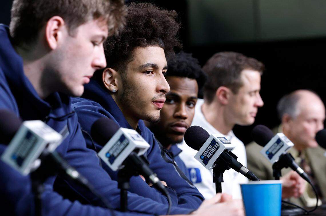 Duke’s Tyrese Proctor, center, answers a question while sitting with Kyle Filipowski, Jeremy Roach and head coach Jon Scheyer during a press availability at the American Airlines Center in Dallas, Texas, Saturday, March 30, 2024. Duke and N.C. State will play Sunday for a trip to the NCAA Tournament Final Four.