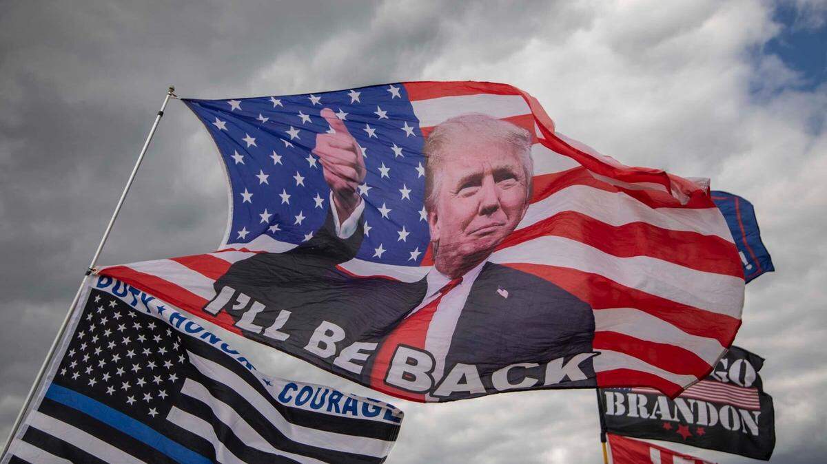 Flags at a Trump rally on April 9, 2022, in Selma, North Carolina.