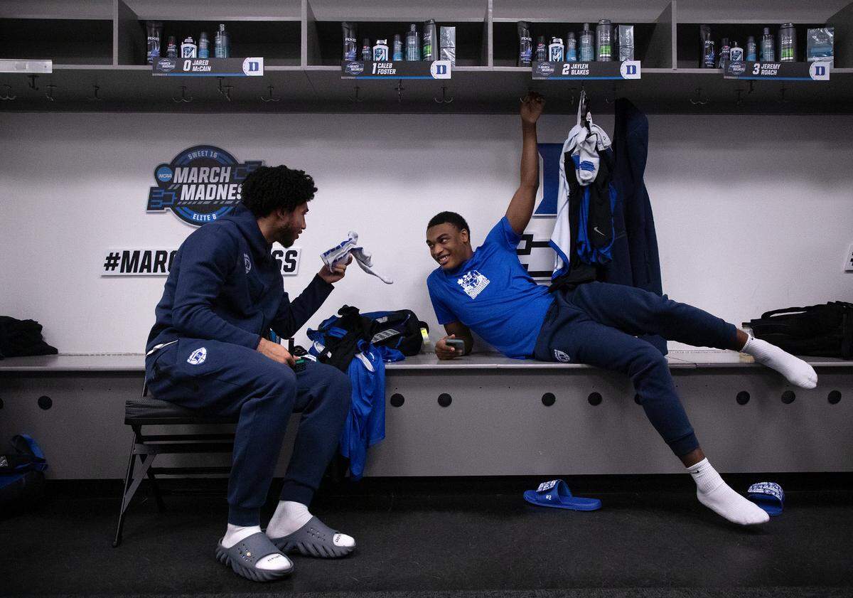 Duke’s Jared McCain and Jaylen Blakes hang out in the locker room on Saturday, March 30, 2024, at American Airlines Center in Dallas, Texas. The Blue Devils will face N.C. State in a NCAA Tournament Elite Eight matchup Sunday.