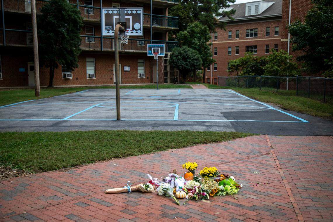 Flowers, candles, notes and momentos forma a makeshift memorial at the Hinton James Residence Hall at UNC-Chapel Hill Monday, Oct. 11, 2021. University officials canceled classes Tuesday after police investigated multiple reports of suicide since the start of classes this fall.
