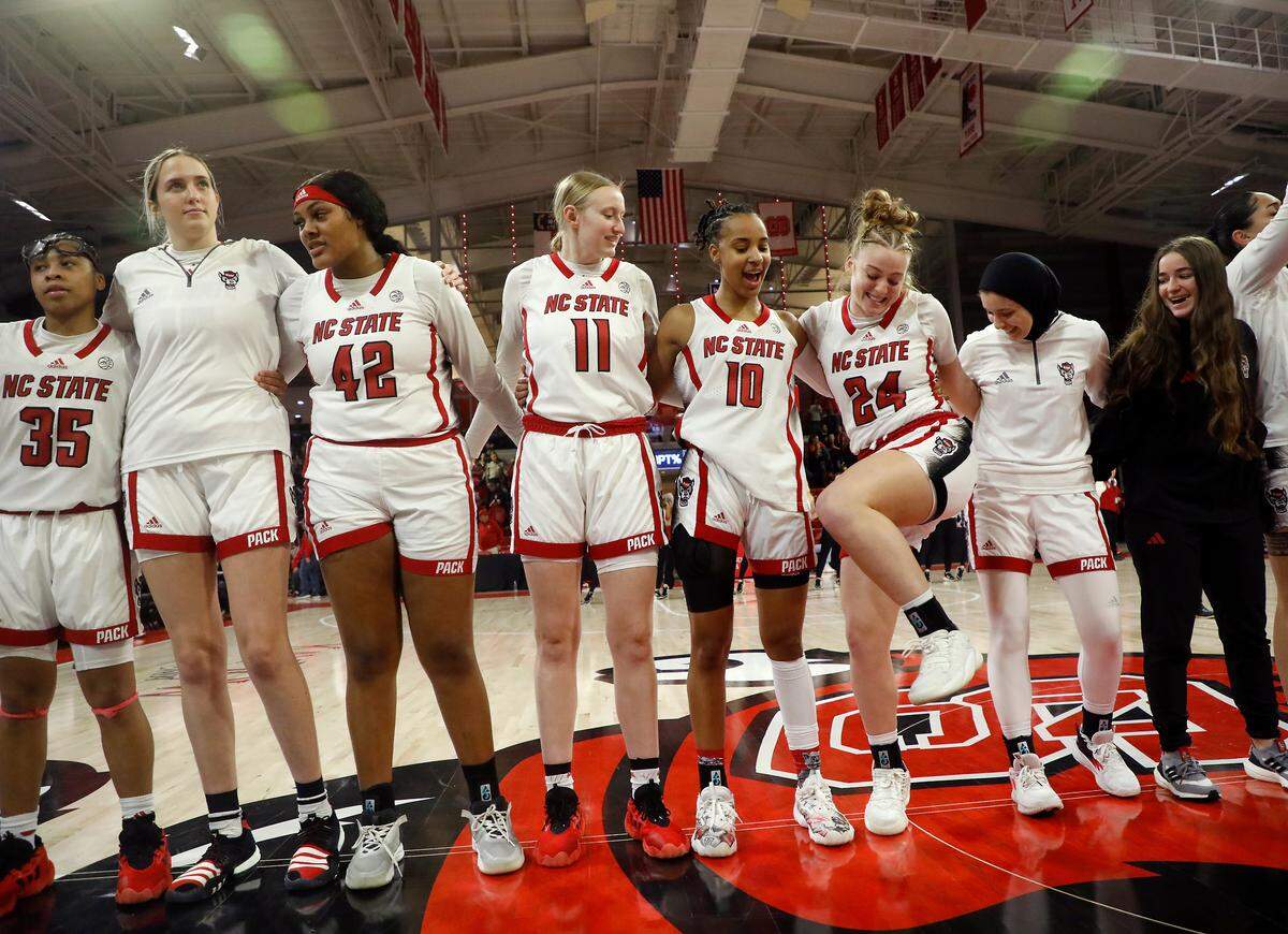 N.C. State’s Laci Steele (24) dances alongside teammates following the Wolfpack’s 88-80 overtime win against Florida State on Thursday, Jan. 4, 2023, at Reynolds Coliseum in Raleigh, N.C.
