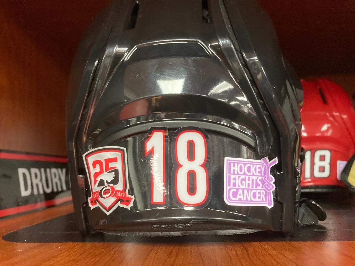 The Carolina Hurricanes game against the Colorado Avalanche on Nov. 17, 2022 at PNC Arena was the Canes’ annual Hockey Fights Cancer game, helping to raise cancer awareness. The Canes wore stickers on their helmets (Chip Alexander)