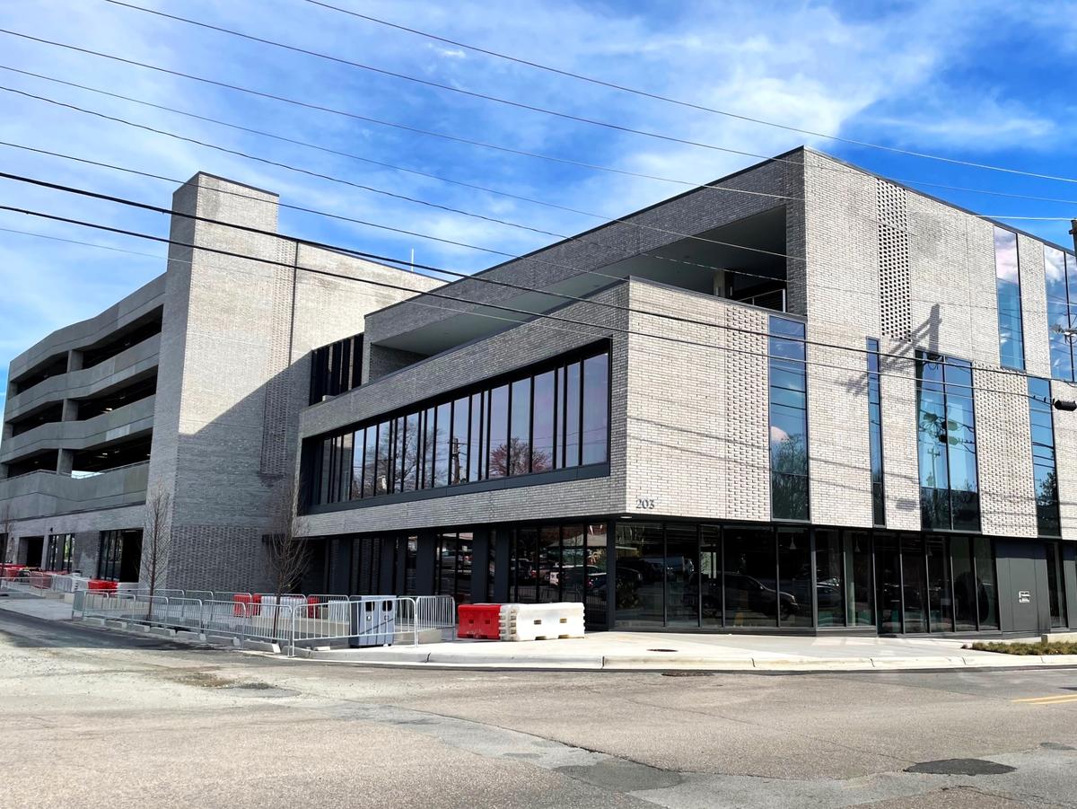 Workers are putting the finishing touches on the Drakeford Library Complex at 203 S. Greensboro St. in downtown Carrboro. The three-story building includes a county library, Skills Development Center, WCOM radio station, and other town and county programs.