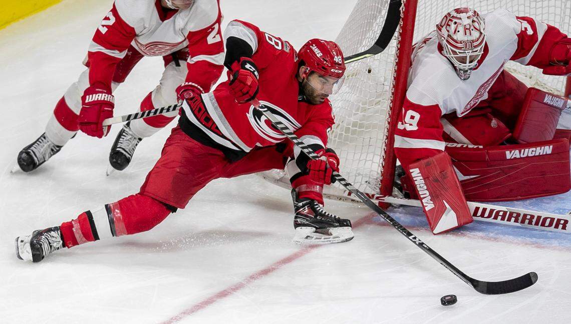 Carolina Hurricanes’ Jordan Martinook (48) tries to score on a warp around against Detroit goalie Alex Nedeljkovic (39) in the third period on Tuesday, April 11, 2023 at PNC Arena in Raleigh, N.C.