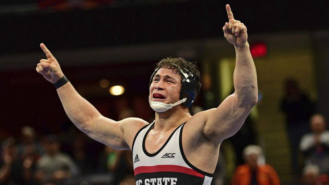 N.C. State's Michael Macchiavello celebrates after defeating Virginia Tech's Jared Haught during the 197-pound championship match of the NCAA Division I Wrestling Championships, Saturday, March 17, 2018, in Cleveland.