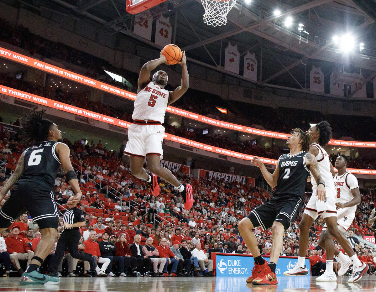 N.C. State’s Tre Holloman drives to the hoop during the second half of the Wolfpack’s 85-79 win over VCU on Monday, Nov. 17, 2025, at the Lenovo Center in Raleigh, N.C.