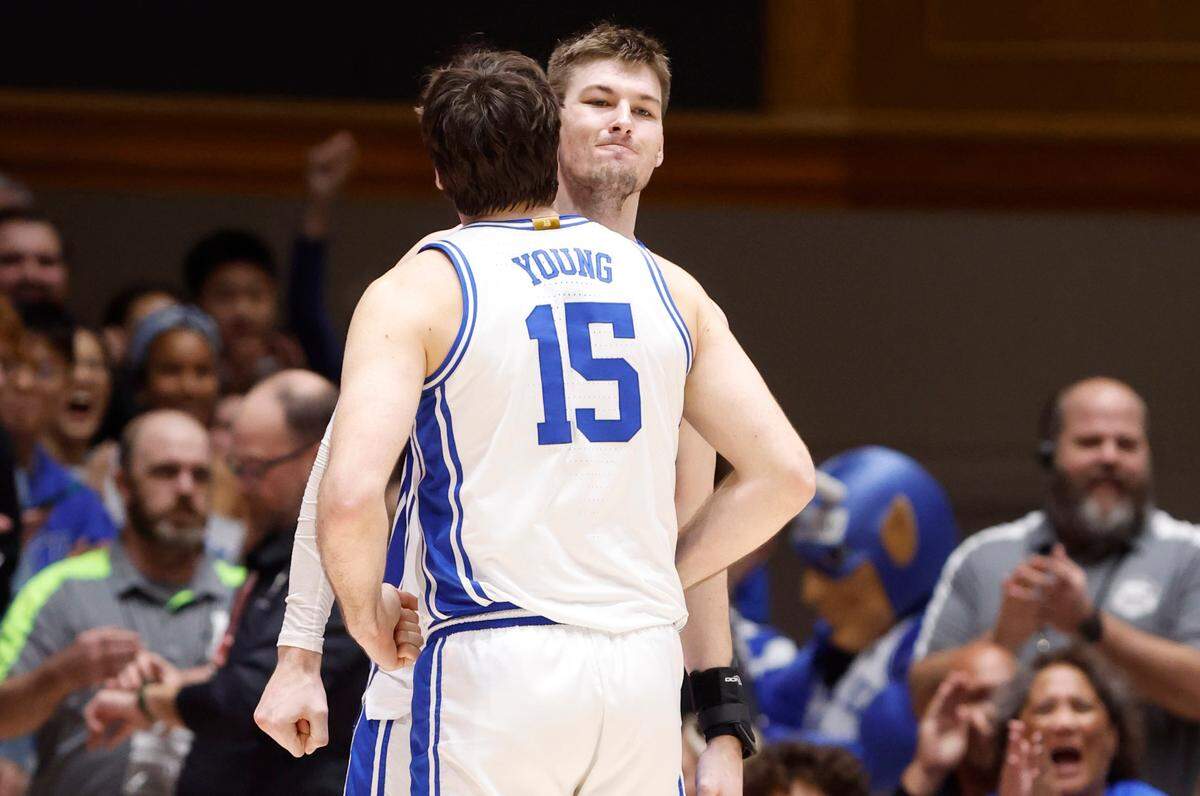 Duke’s Ryan Young (15) bumps chests with Kyle Filipowski (30) after a defensive stop during the second half of Duke’s 84-79 victory over Georgia Tech at Cameron Indoor Stadium in Durham, N.C., Saturday, Jan. 13, 2024.