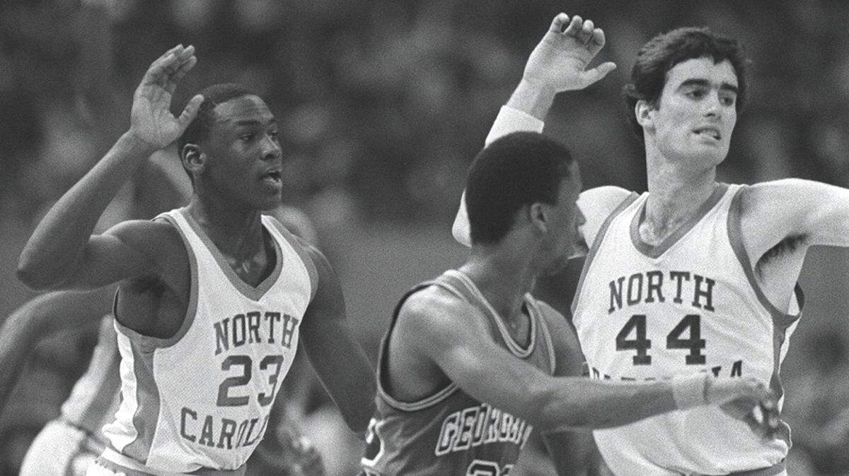 (3/30/1982) UNC VS. Georgetown in 1982 NCAA Championship game in New Orleans. Michael Jordan #23 (left) and Matt Doherty #44 (right) during game that UNC won for the NCAA title. Doherty was named UNC basketball coach today (7/11/00). Davie Hinshaw/staff
