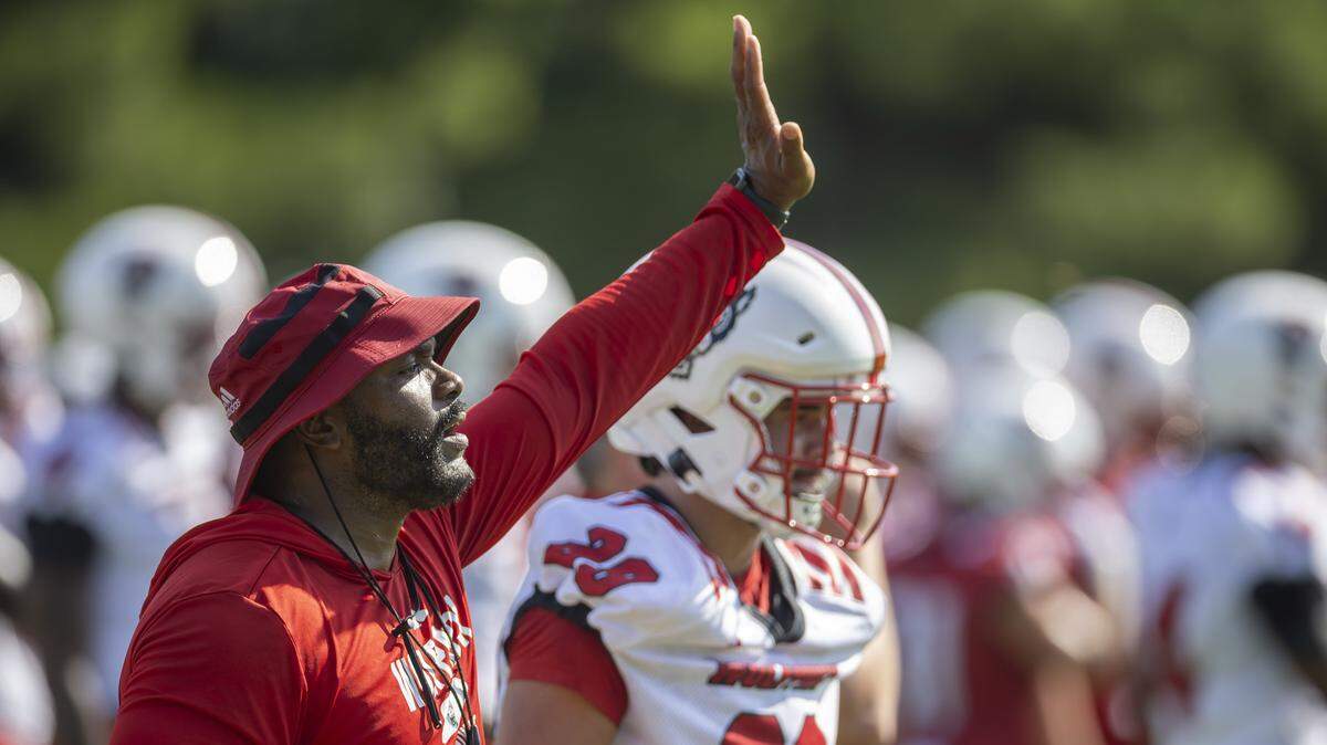 Charlton Warren, N.C. State co-defensive coordinator, safeties, nickels coach, works with his players during the Wolfpack’s practice on Tuesday, July 30, 2025 in Raleigh, N.C.