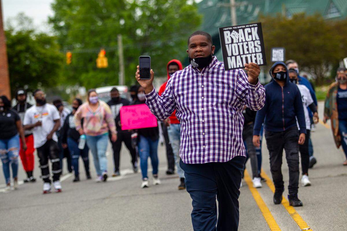Gabriel Adkins, an Elizabeth City councilman, leads demonstrators as they march in Elizabeth City, NC on Saturday, April 24, 2021 in reaction to the death of Andrew Brown Jr., who was shot by a by Pasquotank County sheriffÕs deputies.