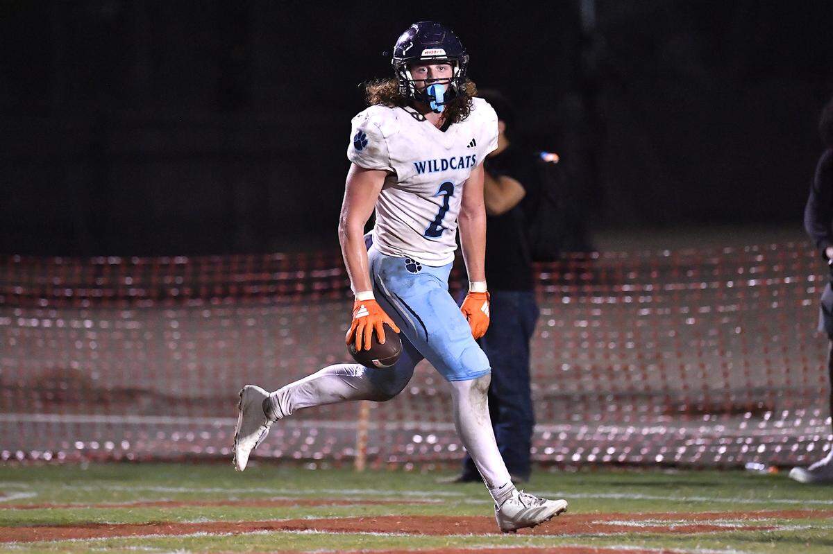 Millbrook linebacker Quinton Cypher (2) runs in the end zone after scoring his second touchdown against Rolesville in the first half. The Millbrook Wildcats and the Rolesville Rams met in a conference football game in Rolesville, N.C. September 26, 2025