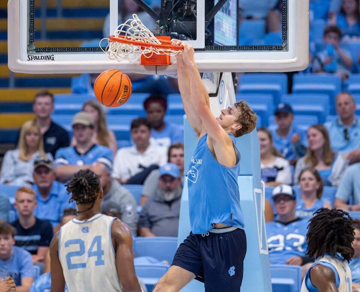 North Carolina’s Cade Tyson (5) gets a dunk over Jae’Lyn Withers (24) in the second half during the Tar Heels’ Blue vs. White scrimmage on Saturday, October 12, 2024 at the Smith Center in Chapel Hill, N.C.