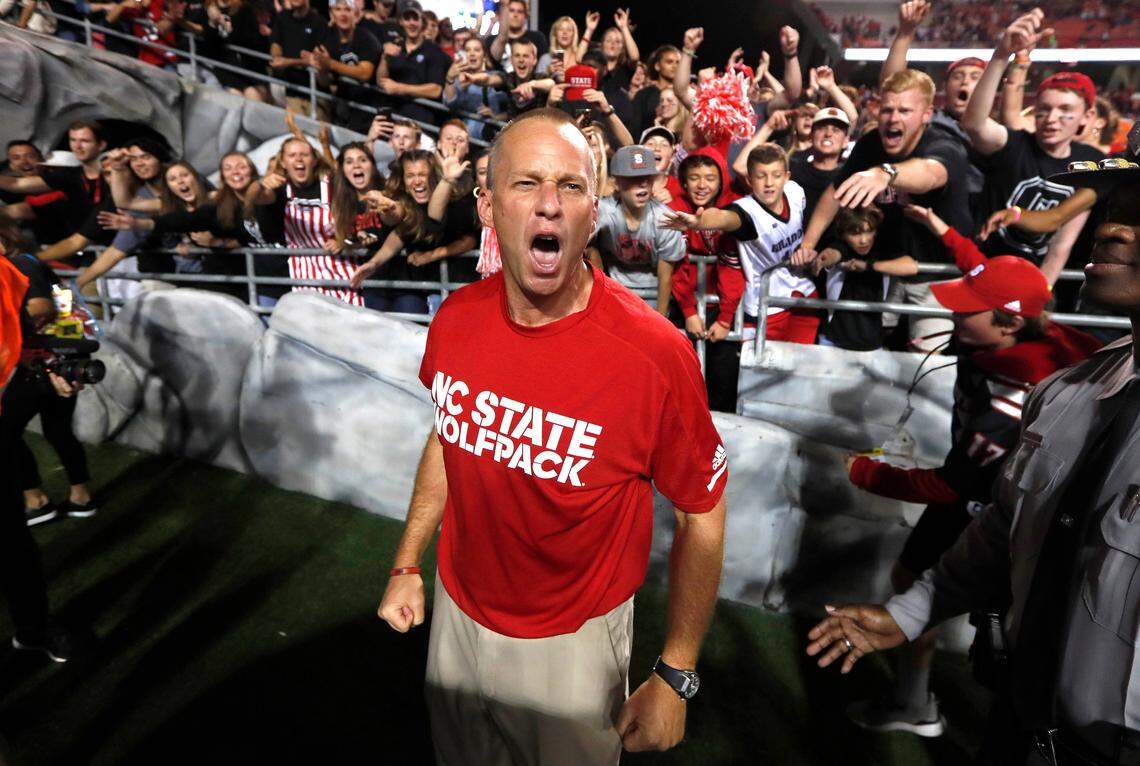 N.C. State head coach Dave Doeren celebrates after N.C. State’s 39-25 victory over Louisville at Carter-Finley Stadium in Raleigh, NC Thursday, Oct. 5, 2017.