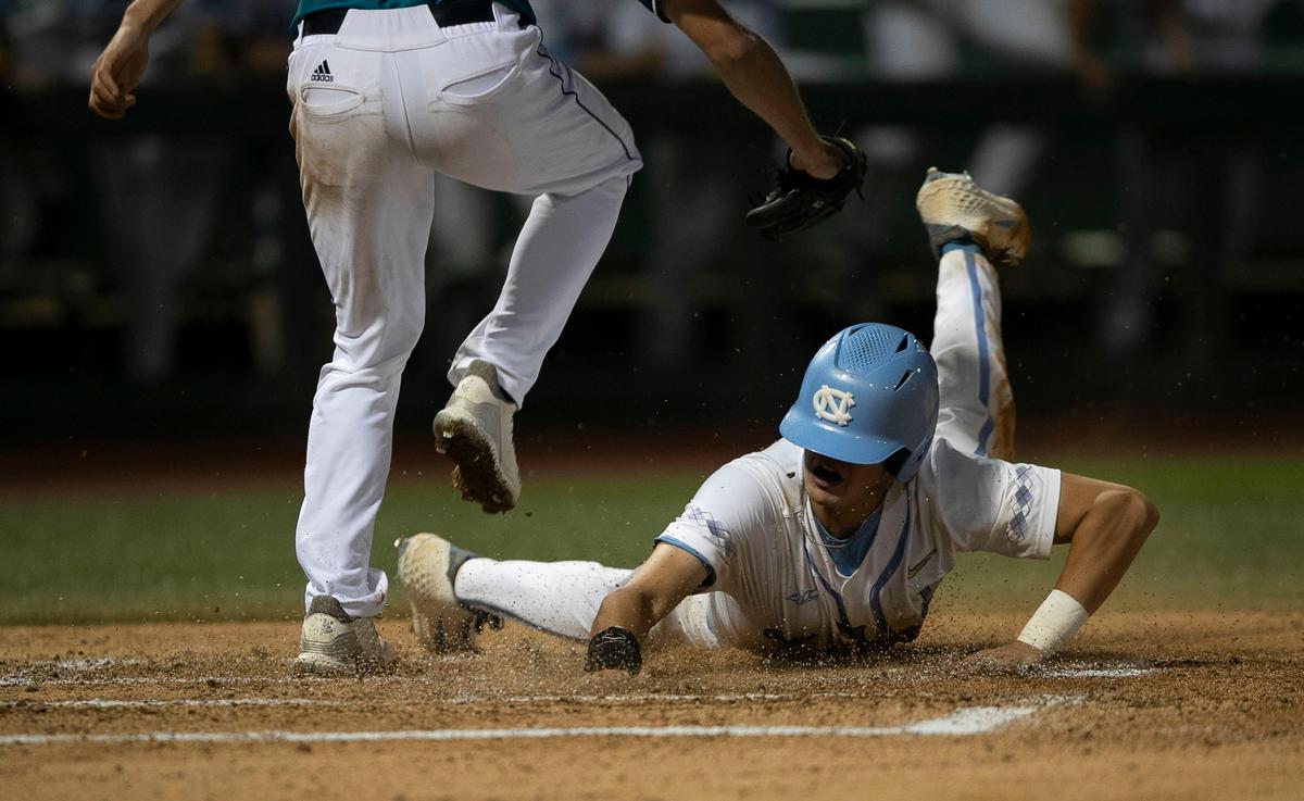 North Carolina second baseman Danny Serretti (1) scores the game winning run on a throwing error by UNC-Wilmington third baseman Cole Weiss to give the Tar Heels’ a 7-6 victory in the NCAA Regional on Friday May 31, 2019 at Boshamer Stadium in Chapel Hill, N.C.