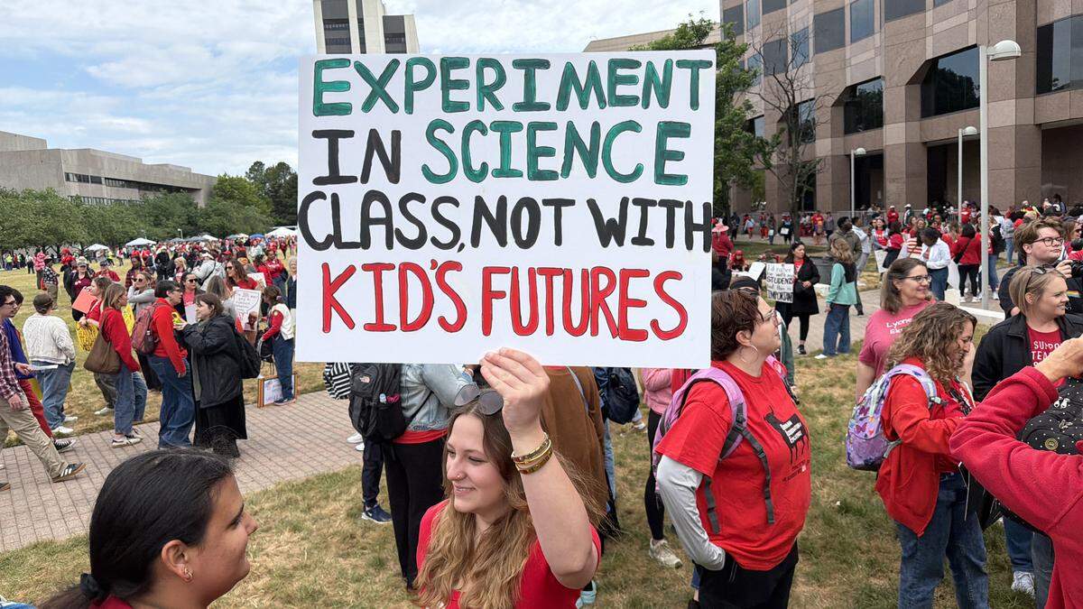Protesters gather on the Halifax Mall in Raleigh before the teacher’s march in downtown, Friday, May 1, 2026.