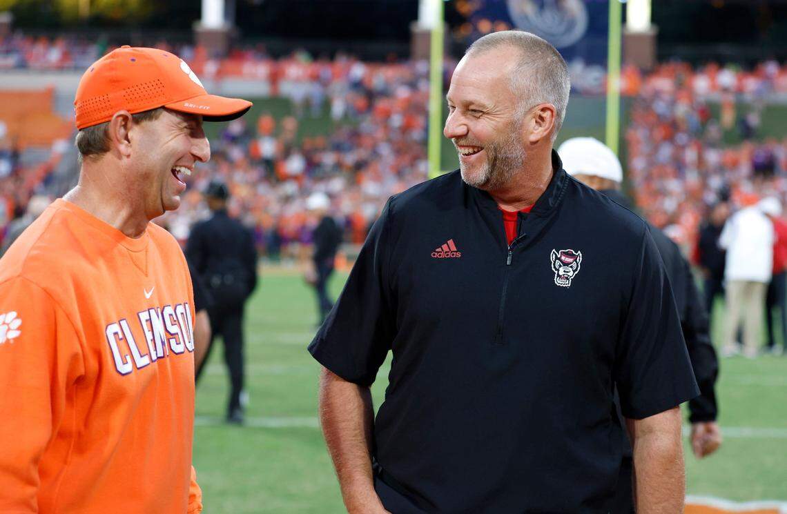 Clemson head coach Dabo Swinney laughs with N.C. State head coach Dave Doeren before N.C. State’s game against Clemson at Memorial Stadium in Clemson, S.C., Saturday, Oct. 1, 2022.