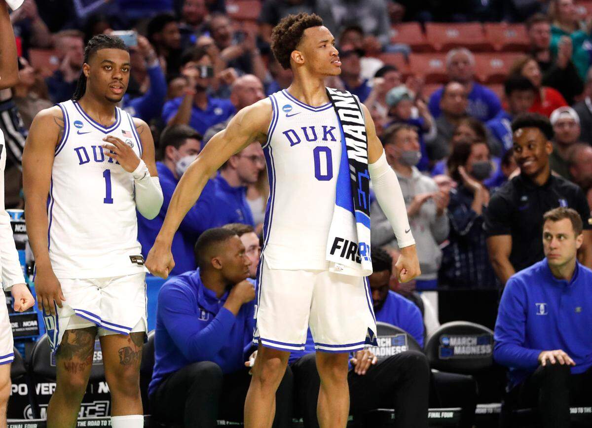 Duke’s Wendell Moore Jr. (0) reacts after Theo John slammed in two during the second half of Duke’s 78-61 victory over Cal State Fullerton in the first round of the NCAA Tournament at Bon Secours Wellness Arena in Greenville, S.C., Friday, March 18, 2022.