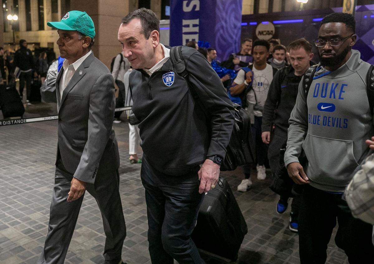 Duke coach Mike Krzyzewski leads the Blue Devils’ into the team hotel, The InterContinental, for the NCAA Final Four on Tuesday, March 29, 2022 in New Orleans, La.